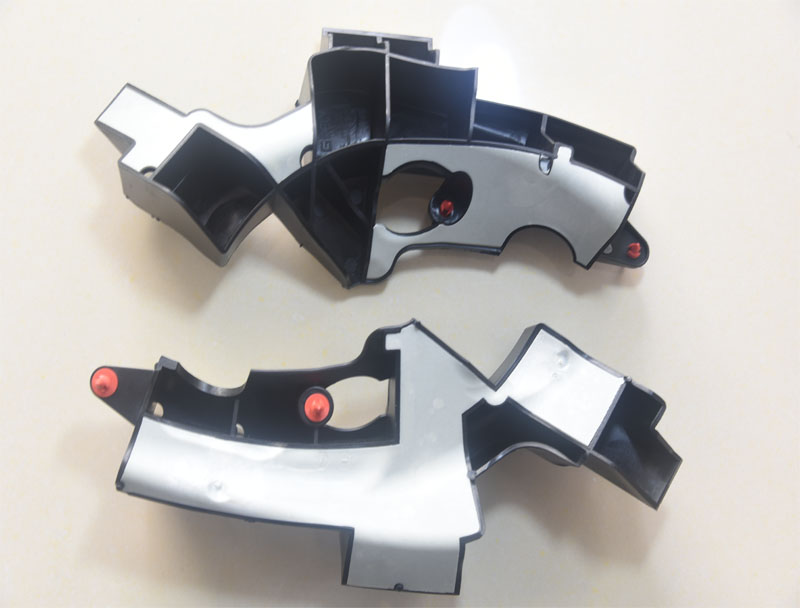 Overmolded plastic parts for Geely